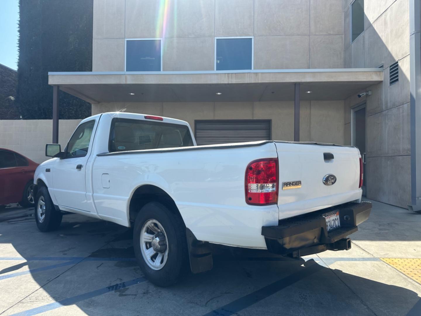 2011 WHITE /GRAY Ford Ranger XL 2WD (1FTKR1AE9BP) with an 4.0L V6 SOHC 12V engine, AUTOMATIC transmission, located at 30 S. Berkeley Avenue, Pasadena, CA, 91107, (626) 248-7567, 34.145447, -118.109398 - Body Style 2-Door REGULAR CAB PICKUP 2-DR Trim XL 2WD Engine 4.0L V6 SOHC 12V Other Transmission AUTOMATIC Drivetrain RWD Ext. Color WHITE Int. Color GRAY Stock Number 7662 VIN 1FTKR1AE9BPA78334 Location Crown City Motors Pasadena, CA WORK TRUCK!!! Crown City Motors is a use - Photo#2